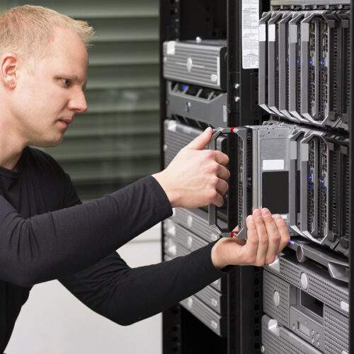 IT technician / engineer install / removes / replace a blade server in a data center.